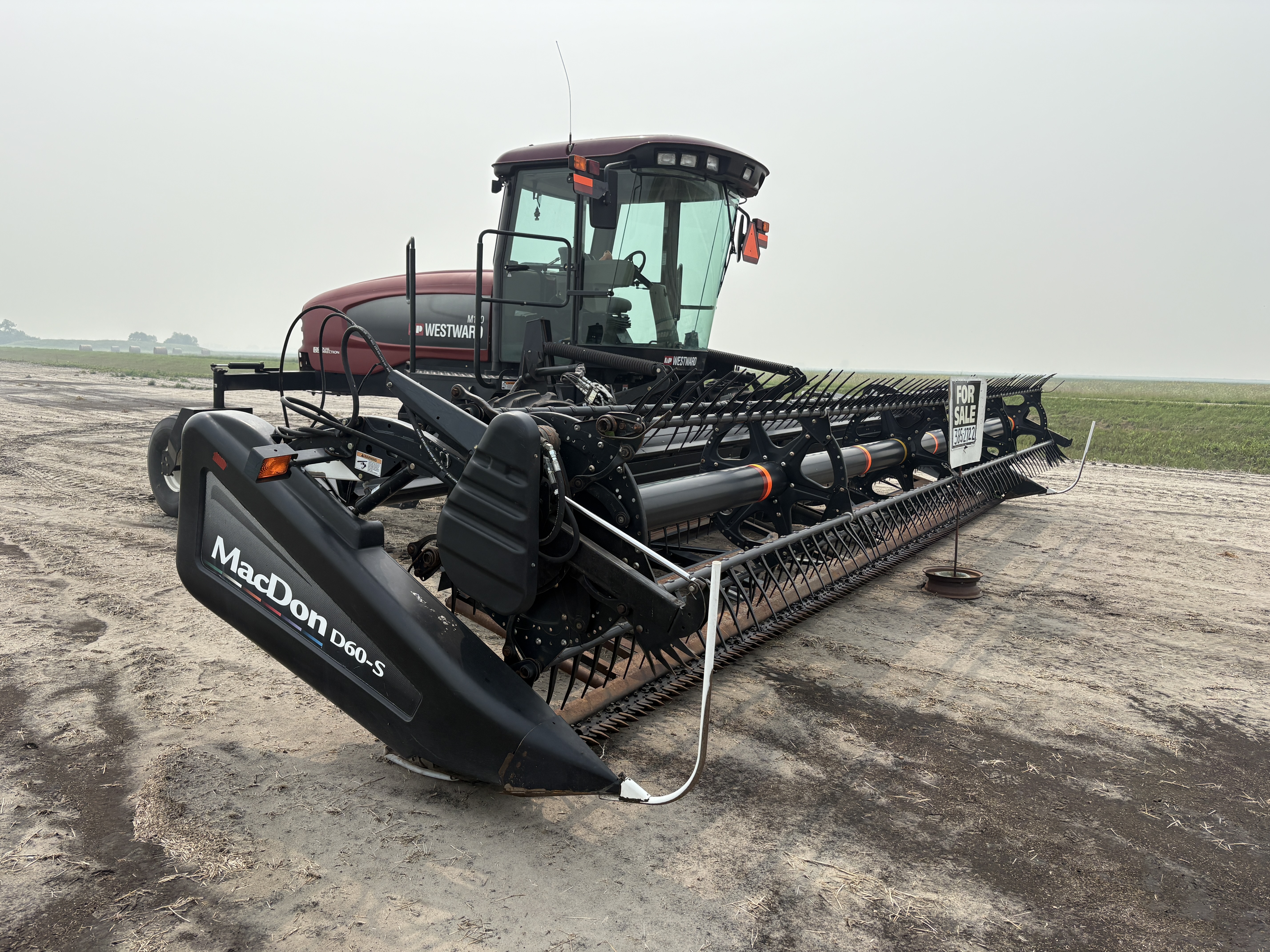2009 MacDon M150 Windrower