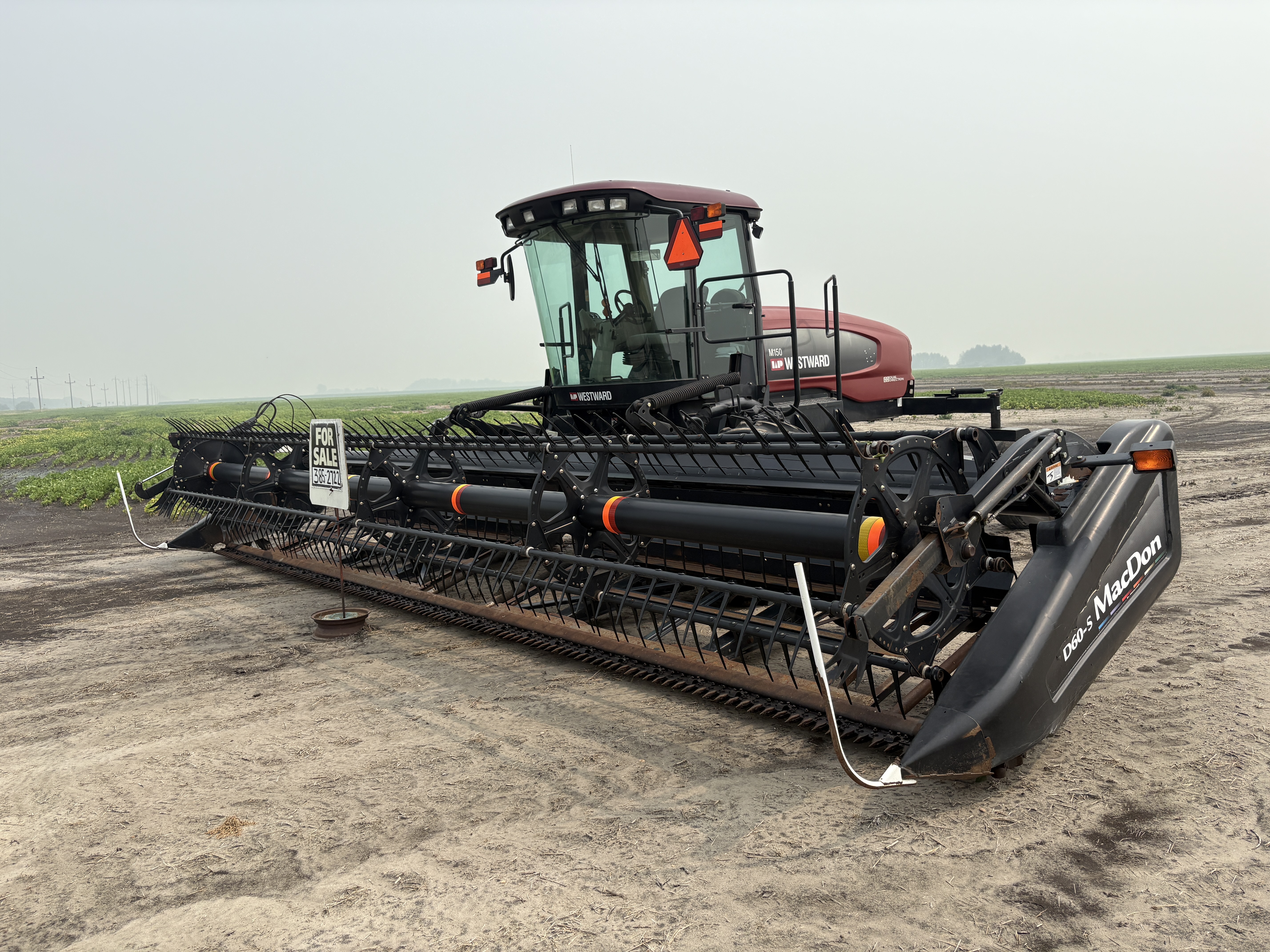 2009 MacDon M150 Windrower