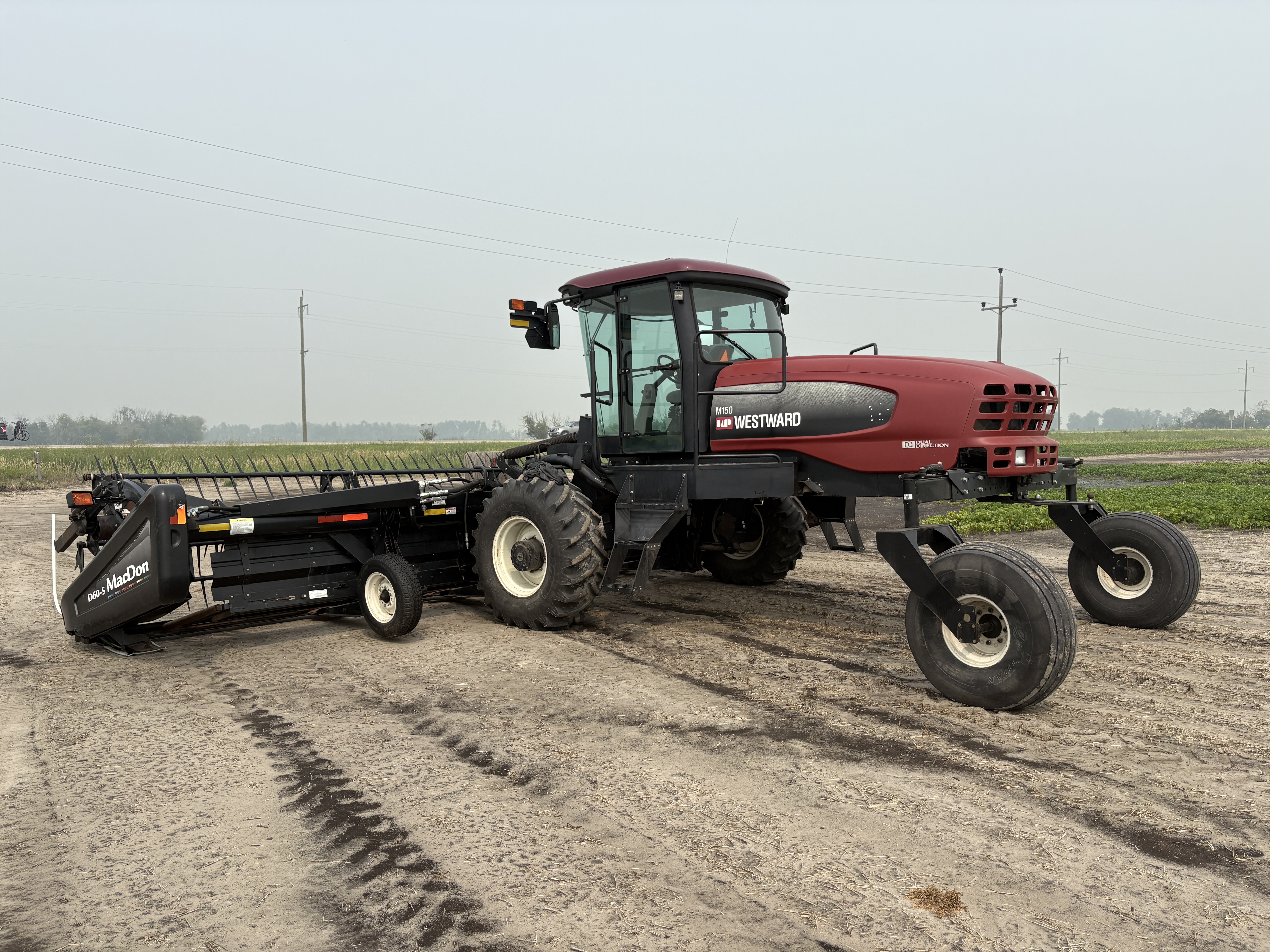 2009 MacDon M150 Windrower
