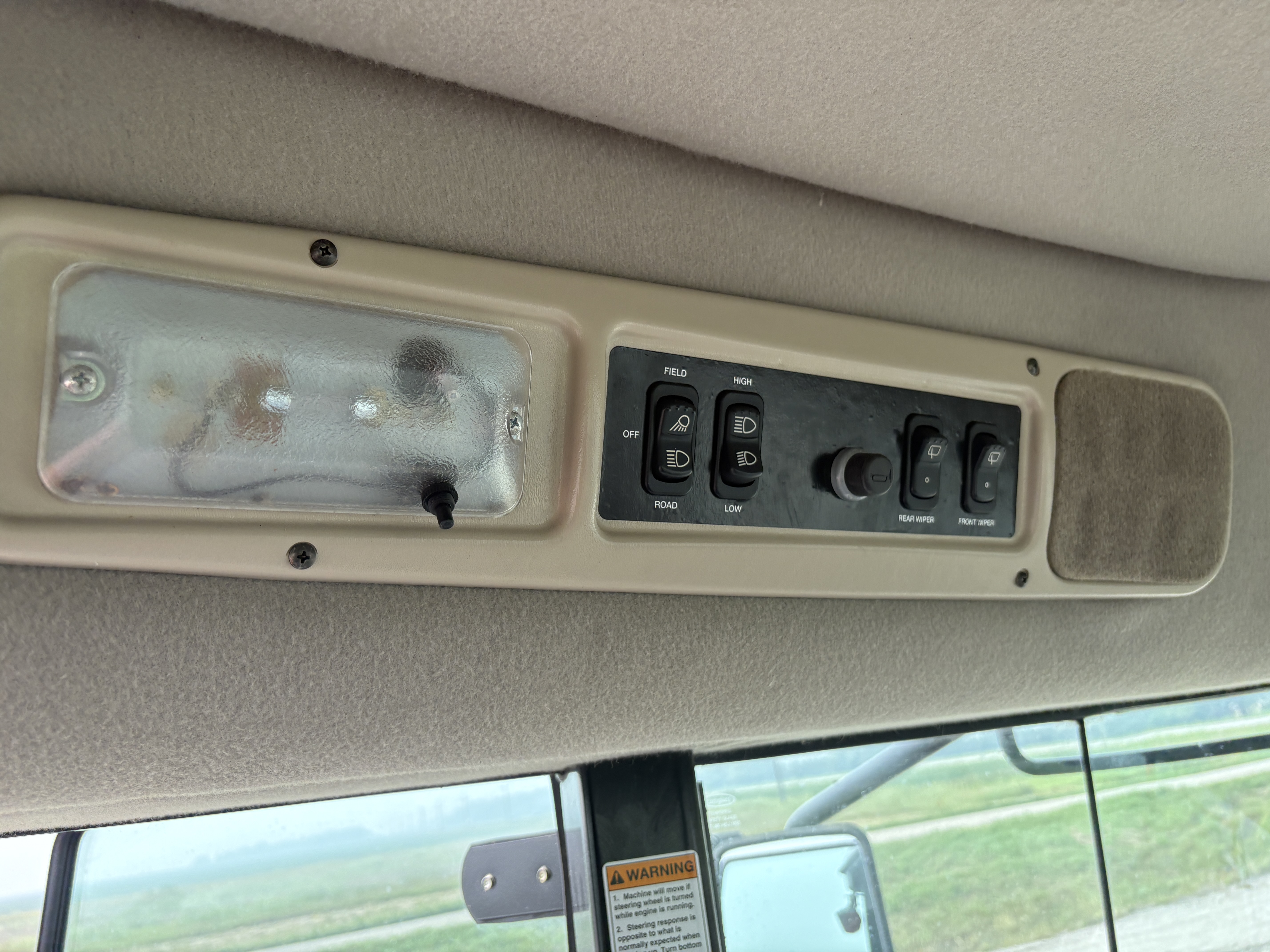 2009 MacDon M150 Windrower