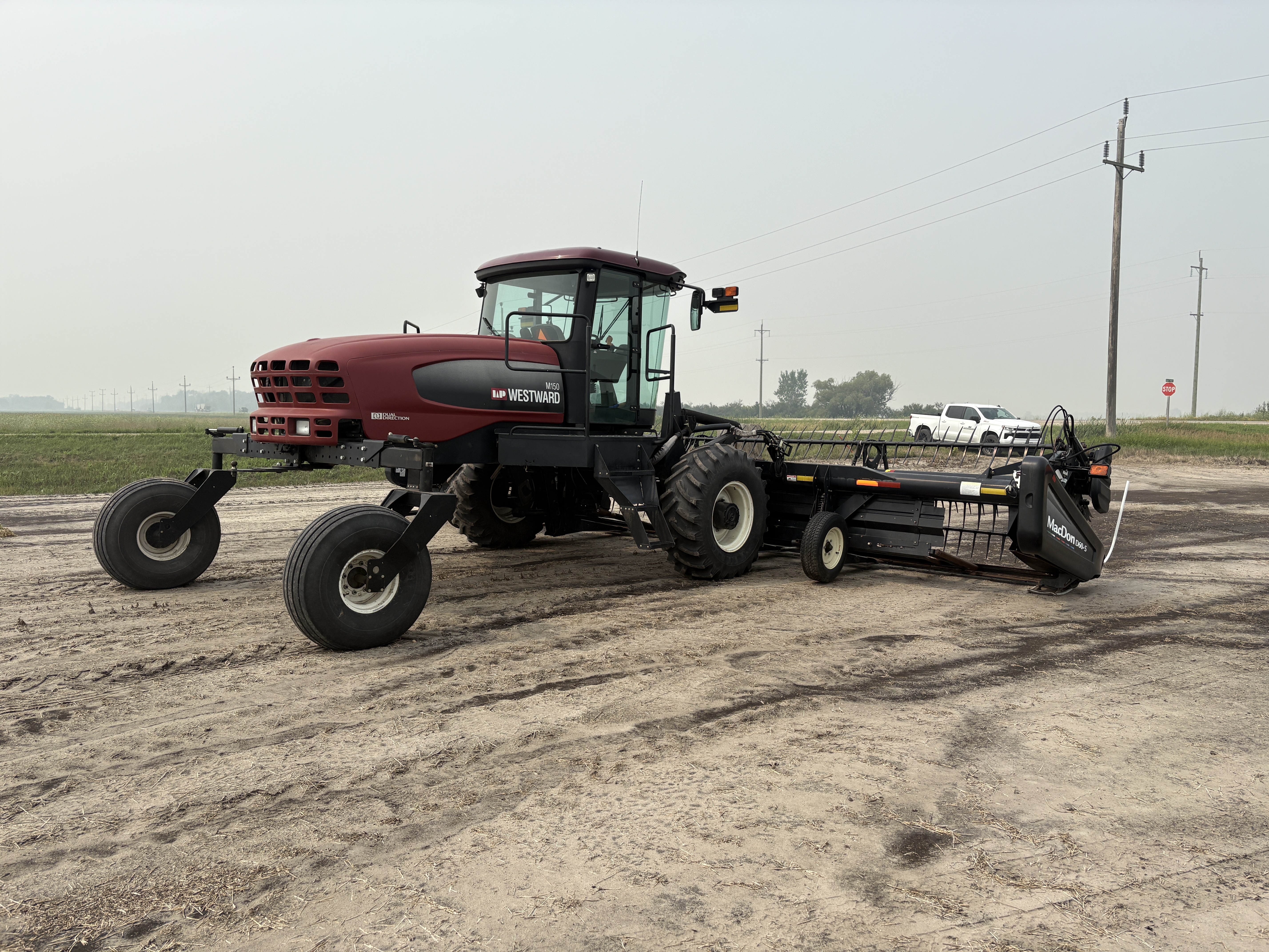 2009 MacDon M150 Windrower
