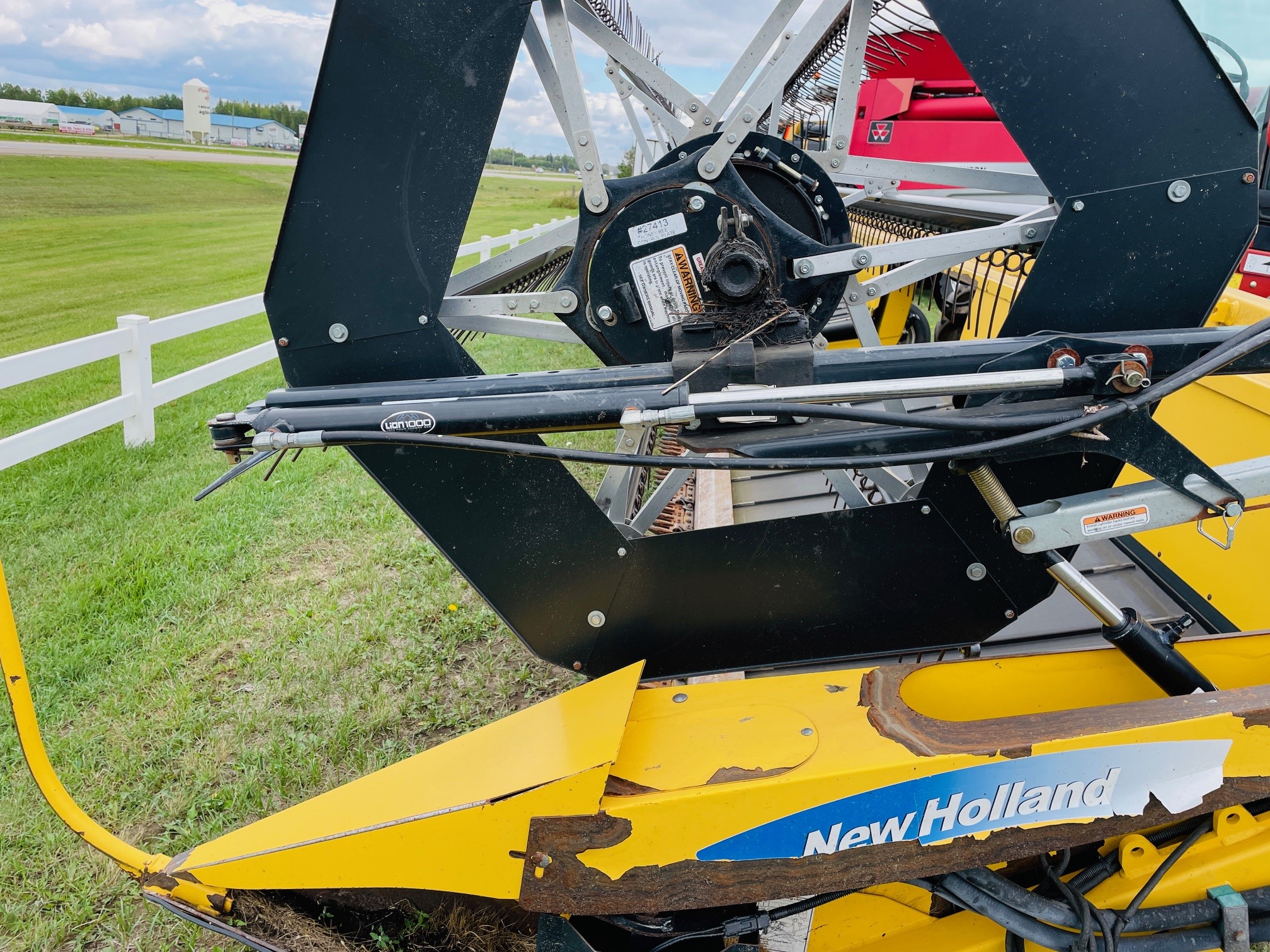 2013 New Holland H8040 Swather