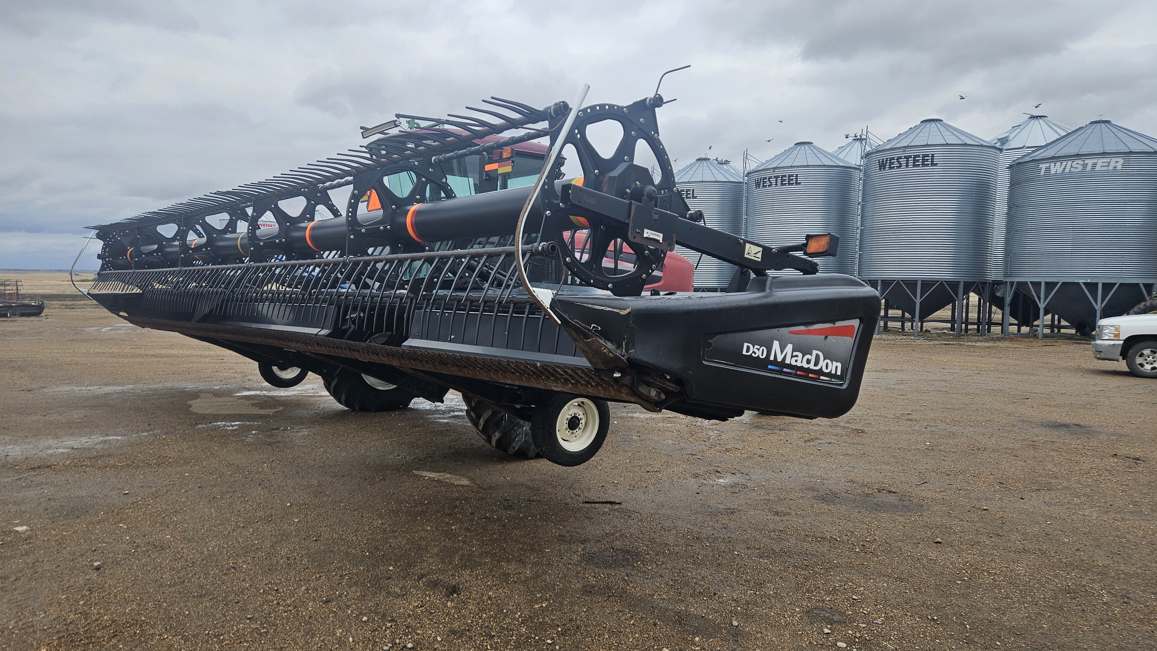 2010 MacDon M150 Windrower