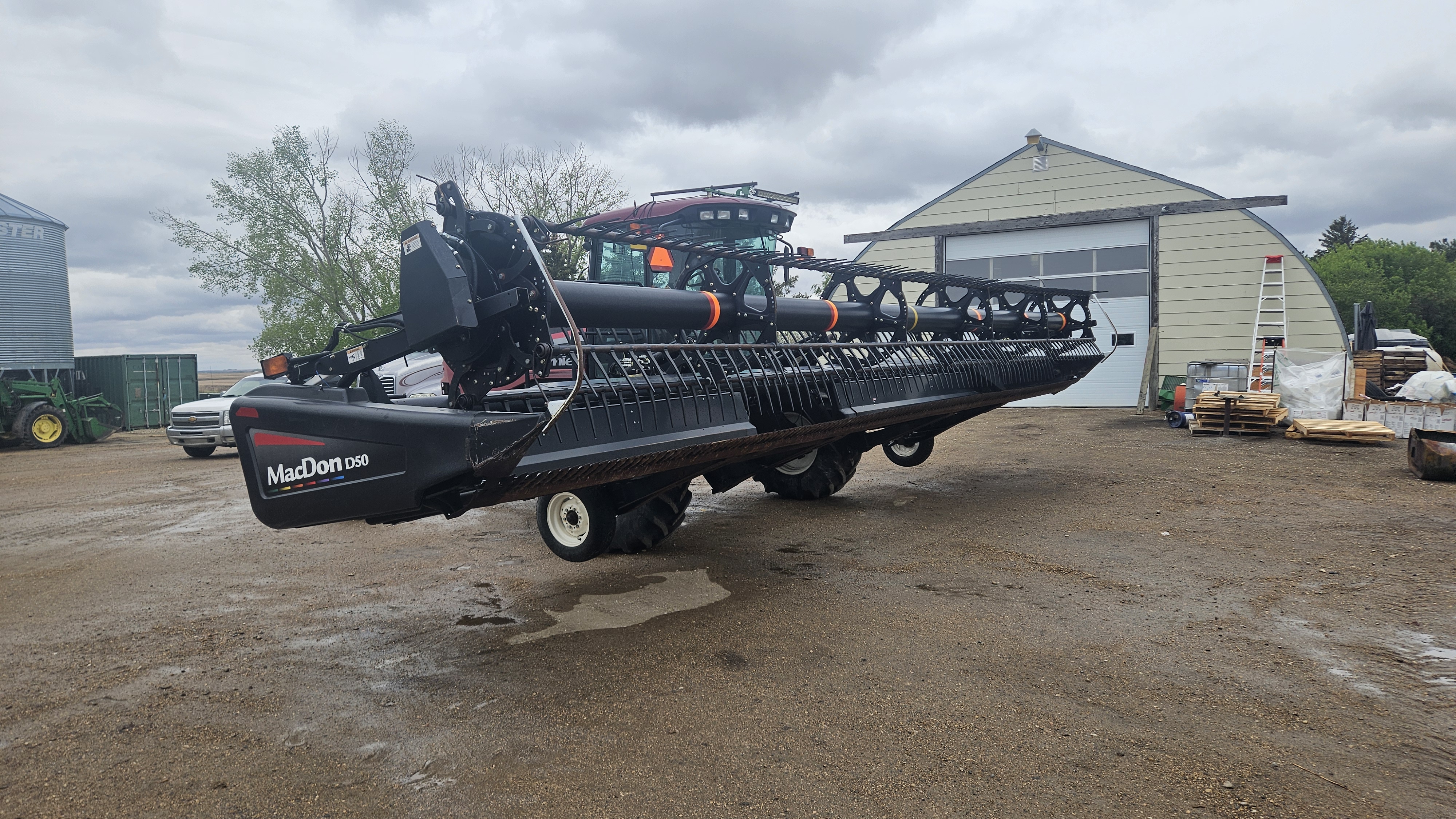 2010 MacDon M150 Windrower