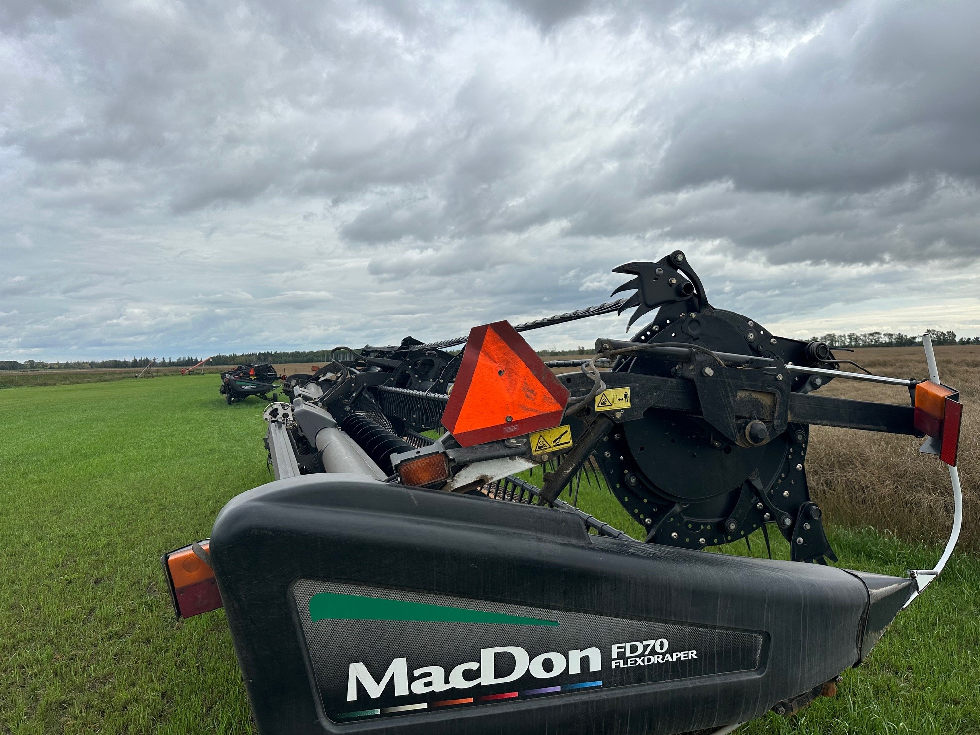 2012 MacDon FD70- JD Header Combine