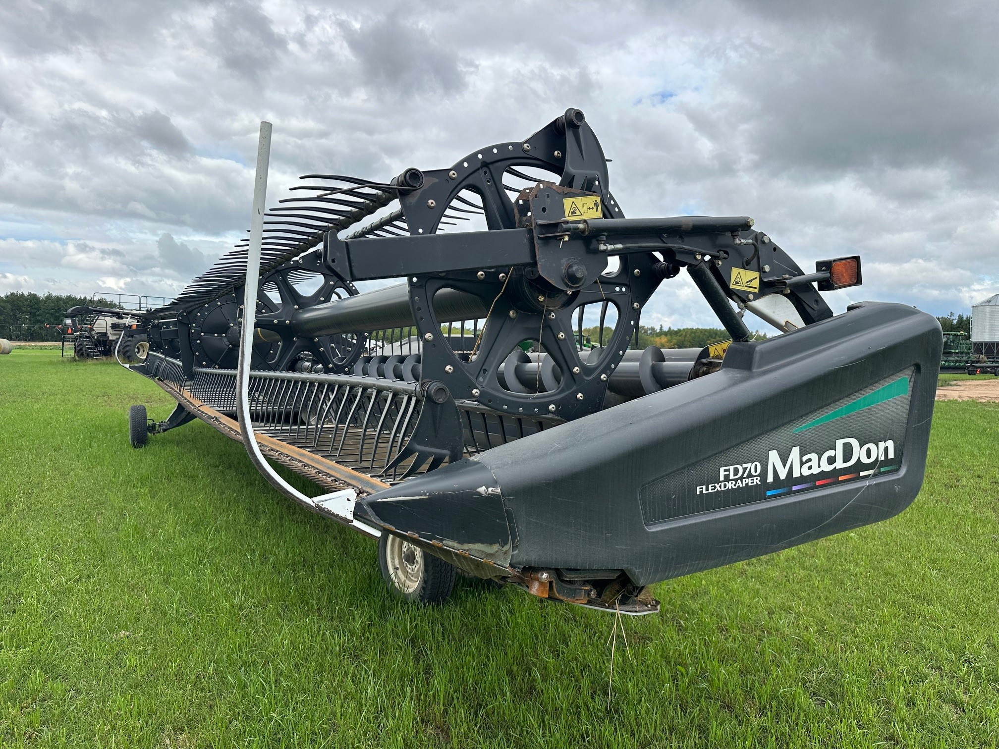 2012 MacDon FD70- JD Header Combine