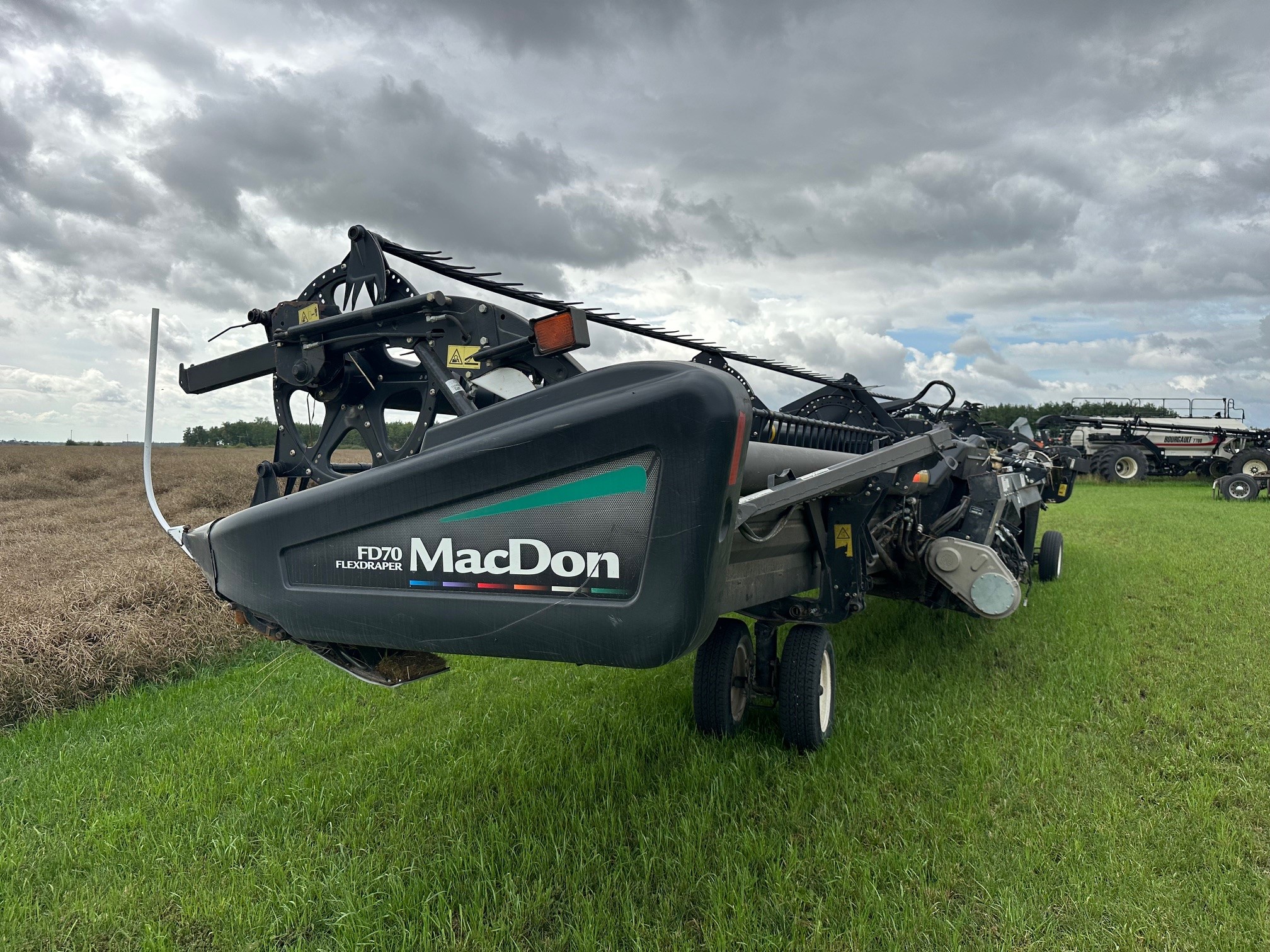 2012 MacDon FD70- JD Header Combine